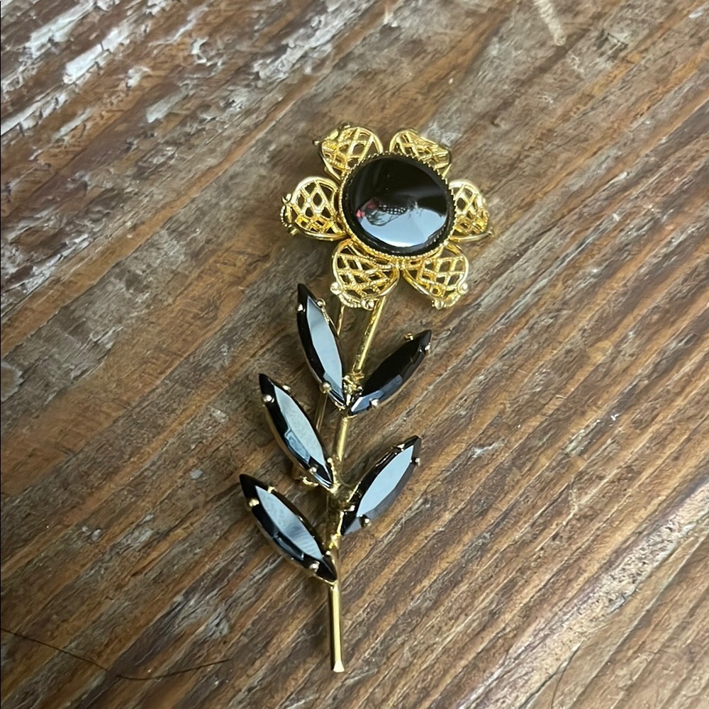 Elegant Gold and Black Floral Brooch